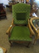 GOOD QUALITY CARVED OAK FRAMED ARMCHAIR WITH SHAPED GREEN DRALON UPHOLSTERED SEAT AND BACK WITH