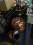 TWO CIRCULAR COPPER HOT WATER BOTTLES, A JUG AND A CHAMBER STICK, TOGETHER WITH A BRASS COAL