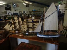 MODEL OF THE CUTTY SARK TOGETHER WITH A FURTHER BLUE AND WHITE PAINTED MODEL OF A BOAT AND ONE