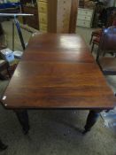 LATE 19TH CENTURY AMERICAN WALNUT WIND-OUT EXTENDING DINING TABLE WITH CANTED CORNERS, RAISED ON