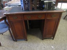 OAK FRAMED SMALL CLERK'S TYPE DESK WITH GREEN REXINE TOP AND THREE DRAWERS OVER TWO PANELLED