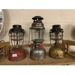 THREE VARIOUS HURRICANE LAMPS VIZ TWO TILLEY LAMPS AND ONE ANCHOR