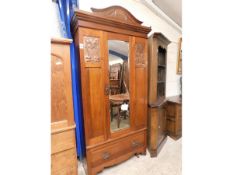 EARLY 20TH CENTURY MAHOGANY MIRROR FRONTED WARDROBE WITH CARVED PEDIMENT AND INSET ART NOUVEAU PRESS