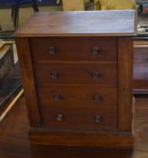 Small "Wellington" chest of typical form, fitted with four drawers with locking side flap on a