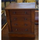 Small "Wellington" chest of typical form, fitted with four drawers with locking side flap on a