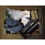 Large box of various camera equipment includes Zenit camera, Roniflex X3000 camera, various