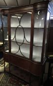 Edwardian mahogany china display cabinet, glazed top with fitted shelving over a fall front door