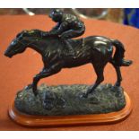 Modern bronze effect study of jockey and racehorse in full flight, 22cm high