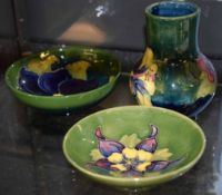 Group of three pieces of Moorcroft ware, mid-20th century, the green ground with tube lined floral
