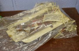 Bag of assorted ivory items including model of a boat, early 20th century, and a number of small