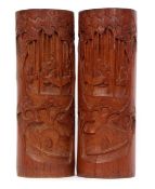 Pair of Chinese bamboo brush pots with typical carving of Chinese figures at various pursuits,