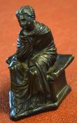 Bronze patinated small seated figure of a cloaked lady, unsigned, 14cm high