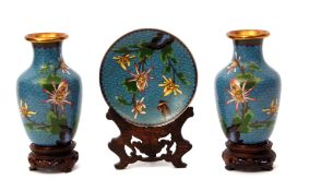 Pair of Japanese cloisonne vases with enamelled decoration of flowers on blue ground, together