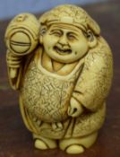 Japanese ivory town crier type figure, 8cm high