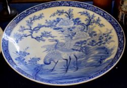 Exceptionally large late 19th century Japanese porcelain charger with blue and white design of