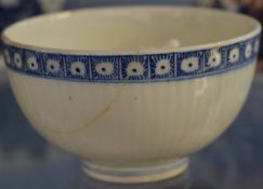 English 18th century tea bowl of ribbed form, probably Lowestoft, with flower sprig to interior, 8cm