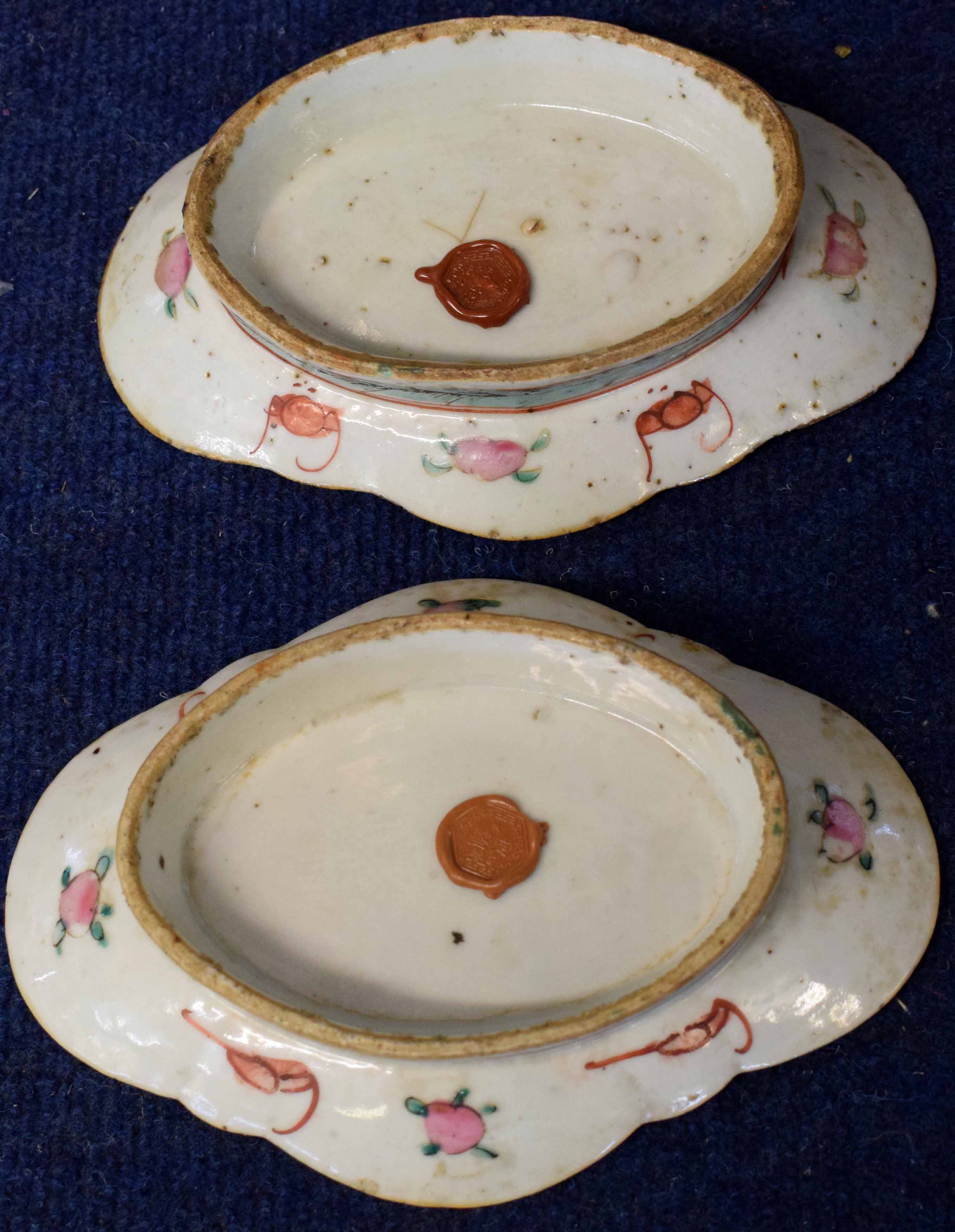 Two shaped Chinese porcelain dishes with polychrome design of figures beside a table, the border - Image 2 of 2