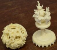 Chinese ivory puzzle ball mounted on a stand with three elephants, 9cm high