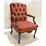 Louise XV type walnut carved armchair with red Dralon upholstery with button back and heavily carved