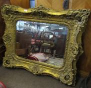 Large gilt framed composition wall mirror, 122cm wide
