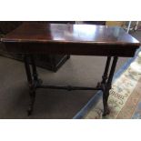 Victorian rosewood small centre table of rectangular form, raised on reeded supports, joined by a