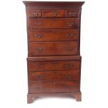Late 18th century yew wood chest on chest, keyhole moulded and blind fretwork cornice over an