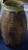 Large Studio Pottery baluster vase, the green ground with streaked brown decoration and impressed