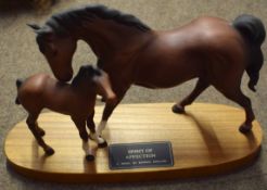 Beswick model of a horse and foal, entitled Spirit of Affection, the animals on a large wooden