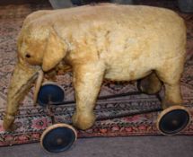 Vintage Triang type stuffed wheeled elephant toy, 67cm long