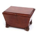 Early 19th century mahogany wine cooler of tapering rectangular form, the lifting lid with a