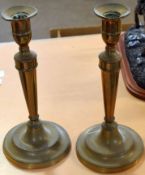 Pair of Victorian copper candlesticks with spreading circular bases, 25cm high