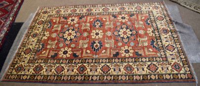 Modern Caucasian style carpet, central panel of geometric lozenges, foliage etc, mainly rust