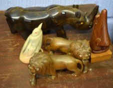 Various hardwood carved models of a rhino, two lions, carved horn model of a bird and one other