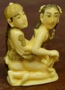 Early 20th century ivory erotic carving of a man and a woman, 4cm high