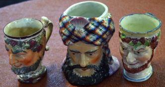 Two late 18th/early 19th century pearlware Bacchus jugs modelled in typical fashion, together with a