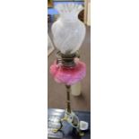 Victorian oil lamp, clear and etched glass shade over a pink glass font raised on a candlestick type