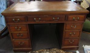 Oak twin pedestal desk, gilt tooled, brown leather inset over three frieze drawers supported by