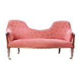 Victorian rosewood double hoop back sofa, upholstered in puce button back with serpentined apron