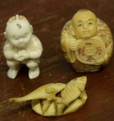 Ivory model of a fish and a small boy, plus a further model of a man with Japanese symbols (3)