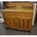 Arts & Crafts light oak Cotswold School sideboard fitted with two open shelves over two panelled