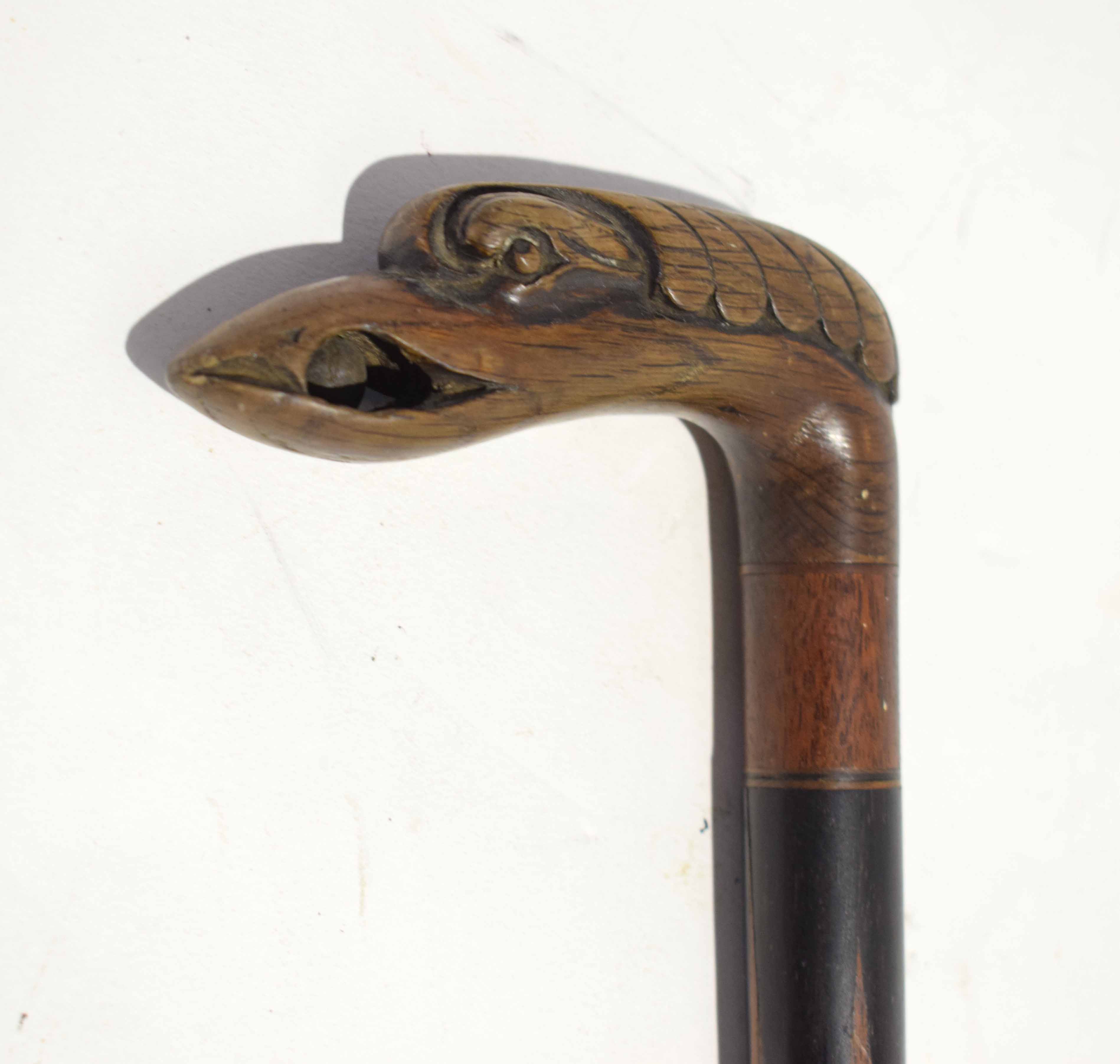 Walking cane modelled with a swan's beak enclosing a wooden ball - Image 2 of 2