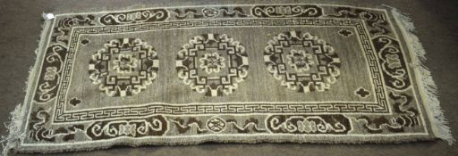 Caucasian style small rug decorated in shades of brown, beige and grey, 180 x 84cm