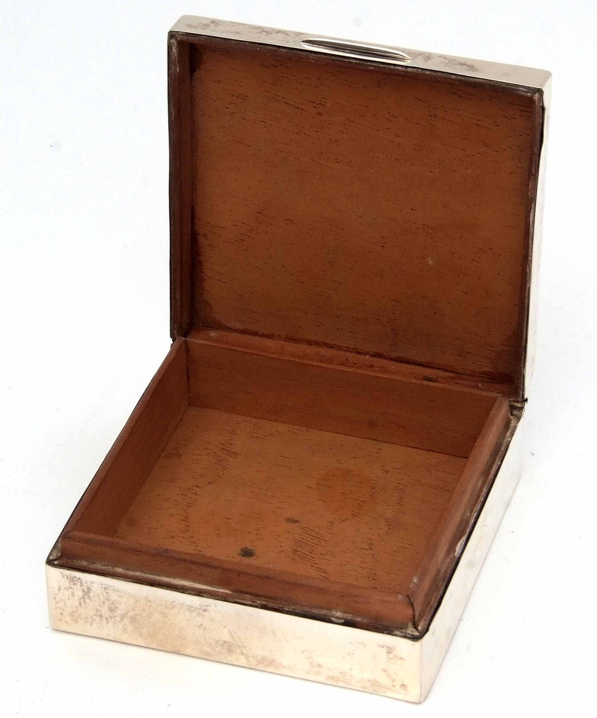 George V table cigarette box of square form, the hinged cover with engine turned decoration and - Image 2 of 2