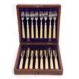 Early 20th century oak cased set of six each fish knives and forks each with polished blades and