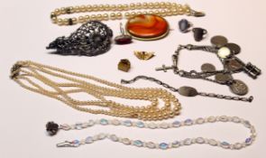 Mixed Lot: oval agate brooch, two simulated pearl necklaces, coin bracelet, ornate pierced scroll