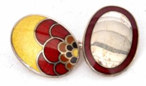 One of two white metal and enamel cufflink