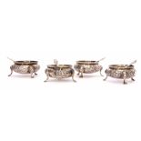 Four Victorian cauldron salts, each with beaded rims, floral and foliate embossed bodies with vacant