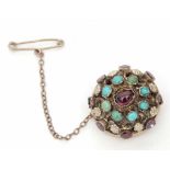 Austro-Hungarian gilt garnet and turquoise brooch, a high dome hollow shape, embellished with scroll