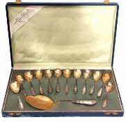 Cased Continental silver and gilt dessert service comprising 12 small spoons, each with gilt bowls