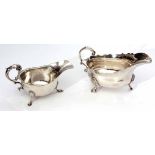 Mixed Lot: comprising two various sauce boats, each of polished form with cut card rims and leaf